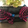 Black clutch bag with blue and pink bow