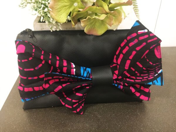 Black clutch bag with blue and pink bow