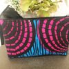 Fabric clutch bag, pink, blue, black background with black PU bow, back view.