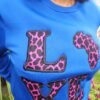 030e1144-7fd0-4aa4-90b1-f97c2dd6e042 Ankara “LOVE Africa” Sweatshirt – Royal Blue | Leopard Print Appliqué