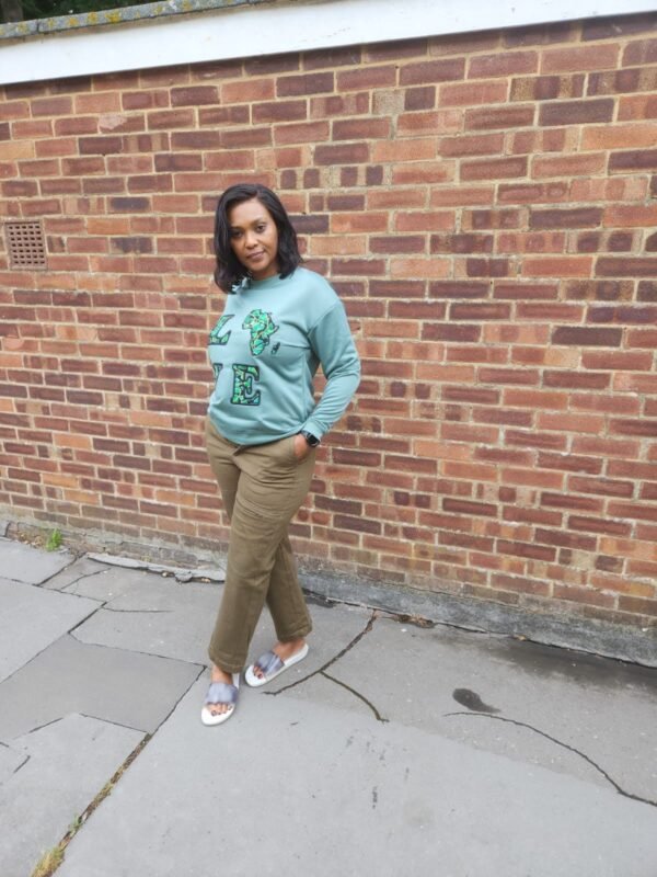 146a1764-8d11-4b56-87f4-c59da5b916bc "LOVE Africa" Ankara Appliqué Sweatshirt – Sage Green