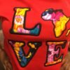 "LOVE Africa" Ankara Appliqué Sweatshirt – Red (Fleece-Lined) "LOVE Africa" Ankara Appliqué Sweatshirt – Red (Fleece-Lined)