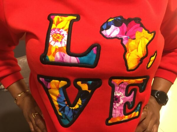 "LOVE Africa" Ankara Appliqué Sweatshirt – Red (Fleece-Lined) "LOVE Africa" Ankara Appliqué Sweatshirt – Red (Fleece-Lined)